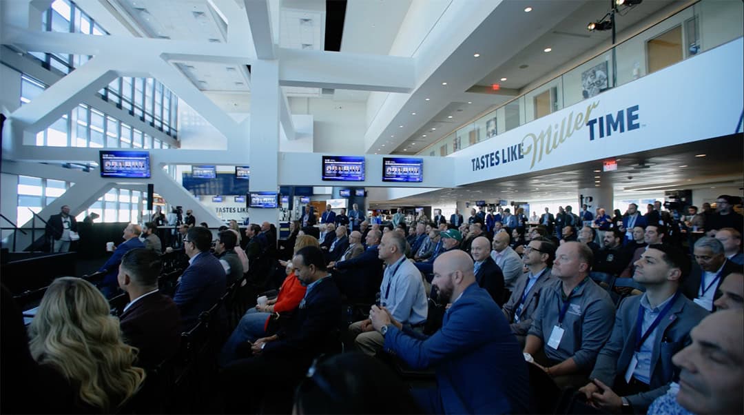 photo of conference attendees watching panel discussion